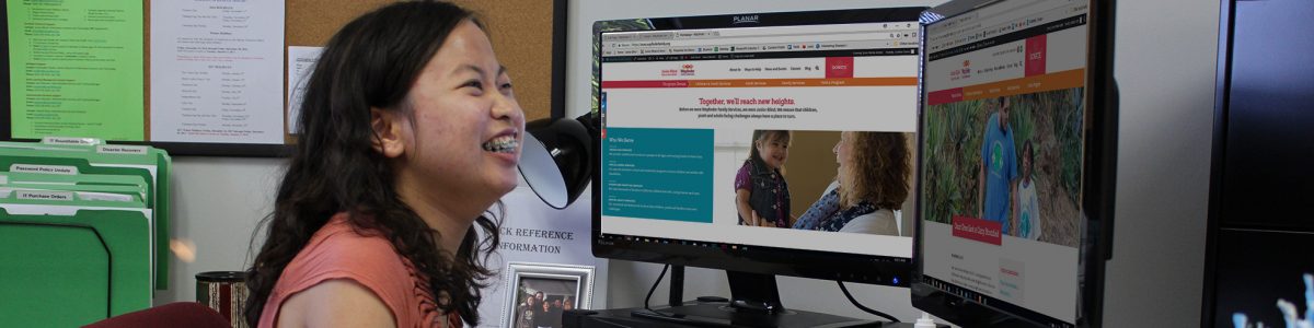 A teen works on her computer during her internship through Wayfinder's youth transition services