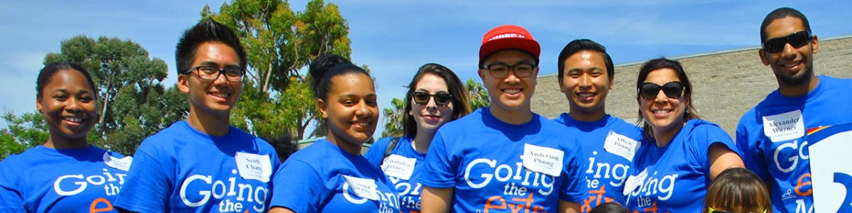 An employee group of volunteers smiles during a Wayfinder event