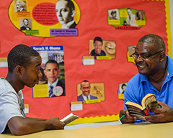 A mental health counselor works with a teenage boy