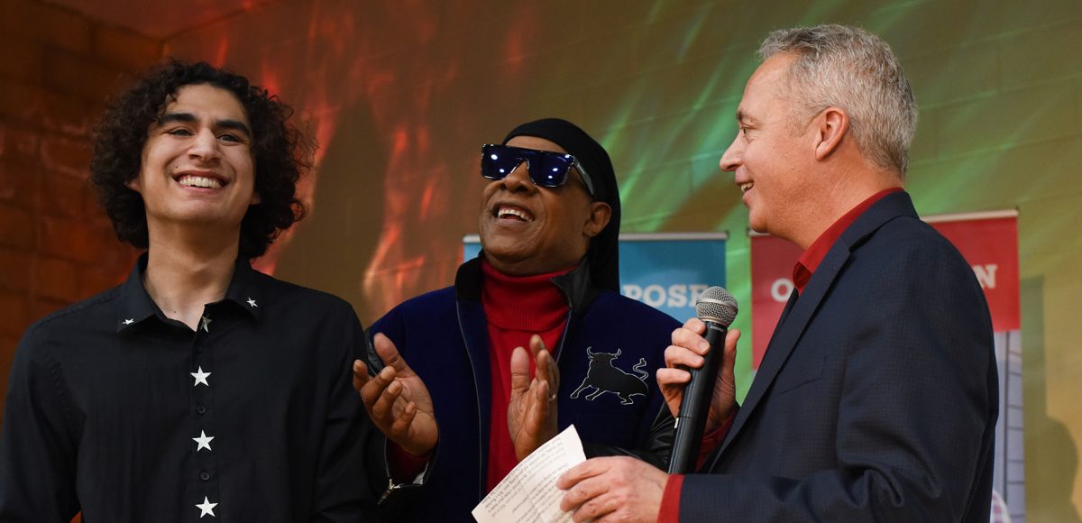 Star student Shane Aguilera with Stevie Wonder and Wayfinder chief operating officer Jay Allen