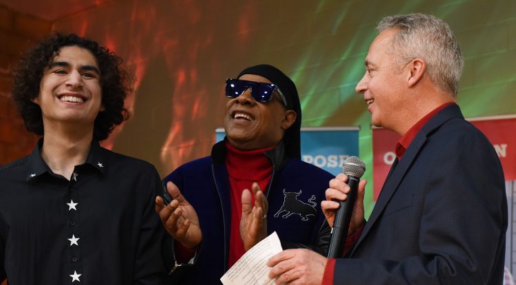 Star student Shane Aguilera with Stevie Wonder and Wayfinder chief operating officer Jay Allen