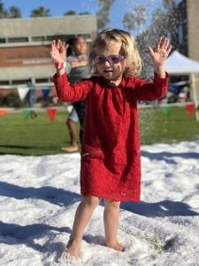 little girl playing in snow