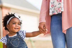 toddler holding adult's hand