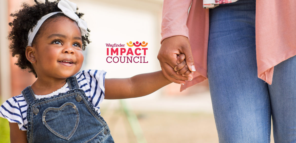 toddler holding adult hand with Impact Council Wayfinder Logo on photo