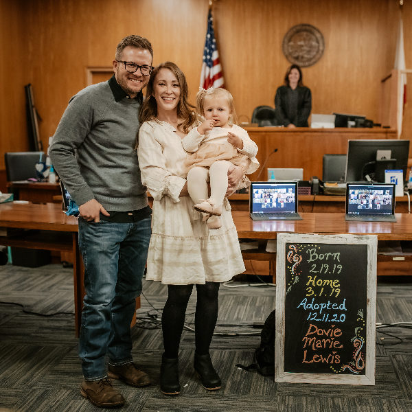 two young parents at courthouse on adoption day