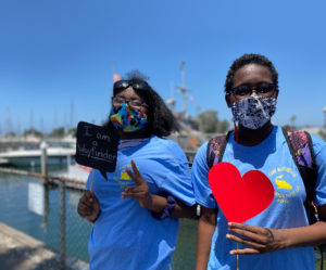 two happy teens shoring their support for Wayfinder